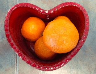 Oranges in Heart Bowl
